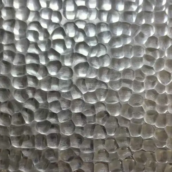 Silver hammered stainless steel sheet with irregular textured pattern
