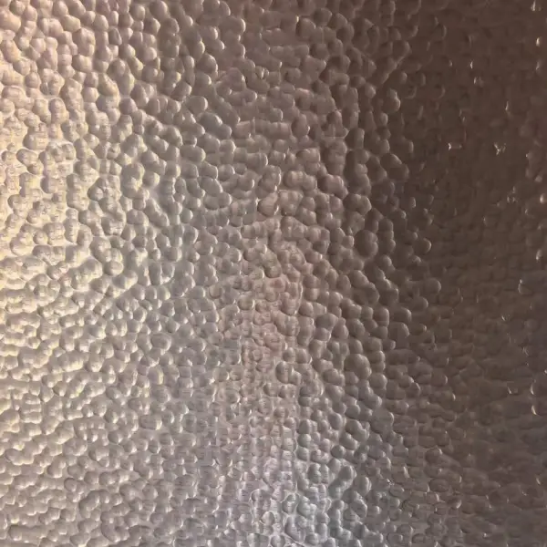 Decorative hammered stainless steel sheet with fine irregular surface texture