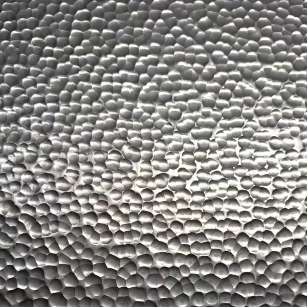 Silver hammered stainless steel sheet with dense rounded texture