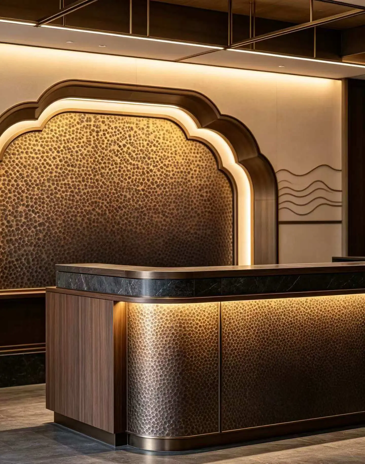 Hammered stainless steel used on a reception desk in a commercial interior